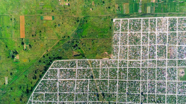 An aerial view of a well-planned urban area with a mix of residential buildings, green spaces, and public transportation options, illustrating the principles of smart growth and sustainable land use practices under state environmental regulations. The image showcases a harmonious integration of nature and development.