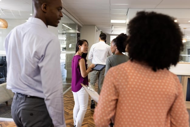 A diverse group of people participating in a job fair, interacting with recruiters and exploring career opportunities.