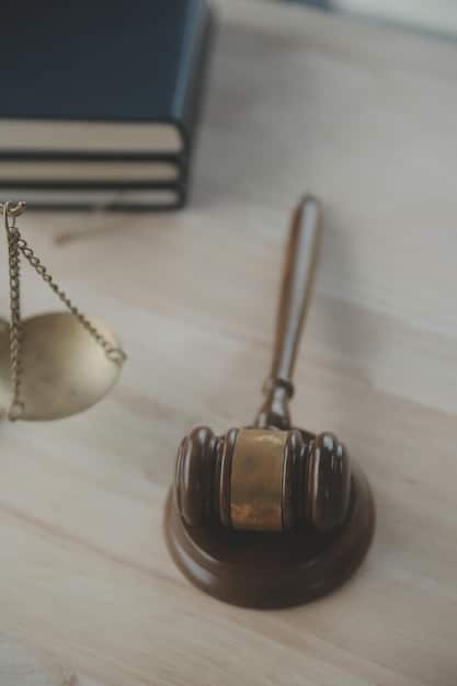 A close-up shot featuring a gavel resting on a stack of legal documents, emphasizing justice and legality. The background is slightly blurred.