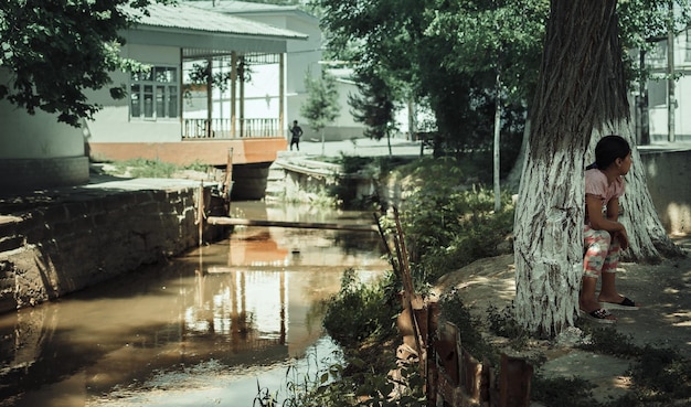 A side-by-side comparison showing a well-funded, modern classroom with abundant resources next to an under-funded classroom with outdated facilities, symbolizing the disparities in resource allocation that can hinder the effectiveness of education reforms.