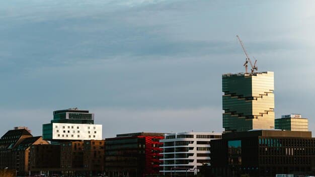 Construction site in an urban setting, with cranes and multiple-story buildings being erected, symbolizing efforts to increase housing supply.